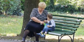 Grandmother and preschooler in park